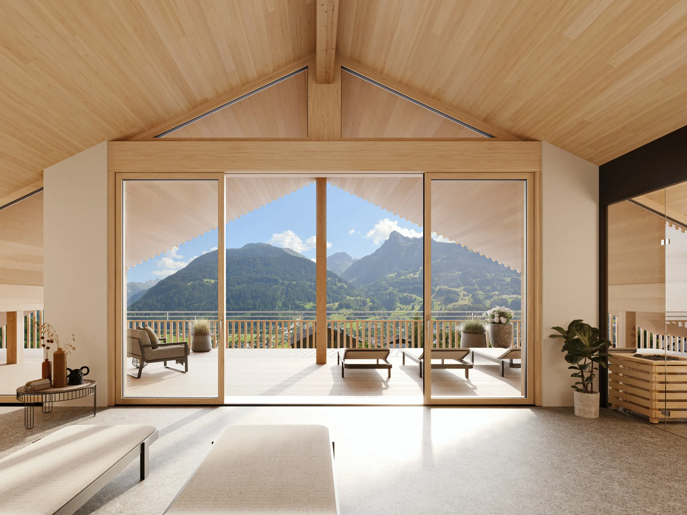 Wohnraum mit Giebelfenster und Blick auf die Berge